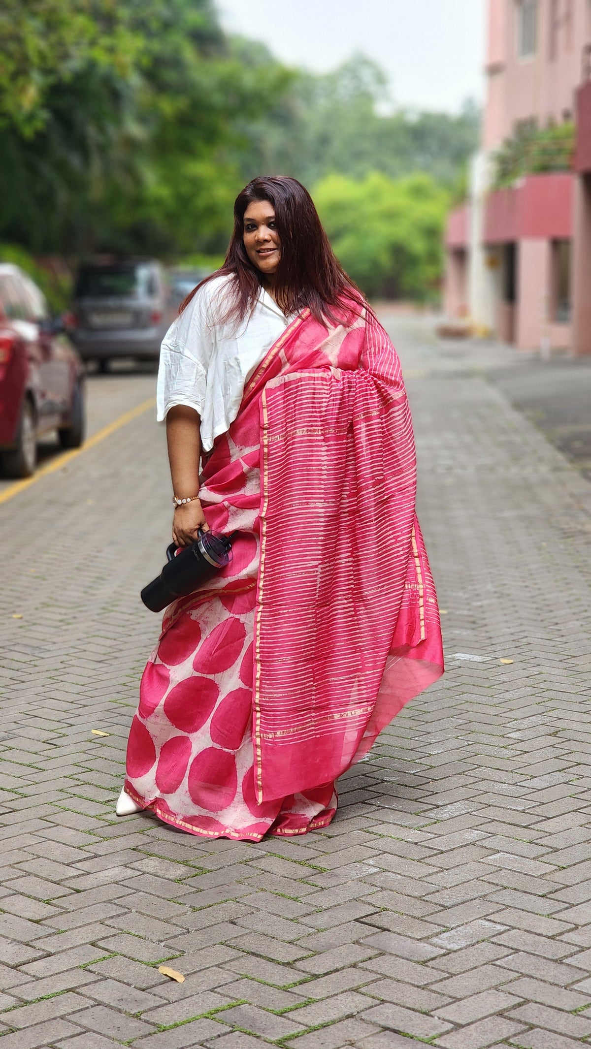 Pink chanderi cotton silk saree with white Bagru handblock motifs and zari border, light and festive handcrafted drape