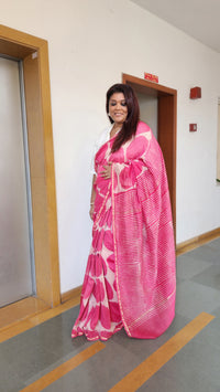 Pink chanderi cotton silk saree with white Bagru handblock motifs and zari border, light and festive handcrafted drape