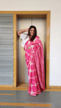 Pink chanderi cotton silk saree with white Bagru handblock motifs and zari border, light and festive handcrafted drape