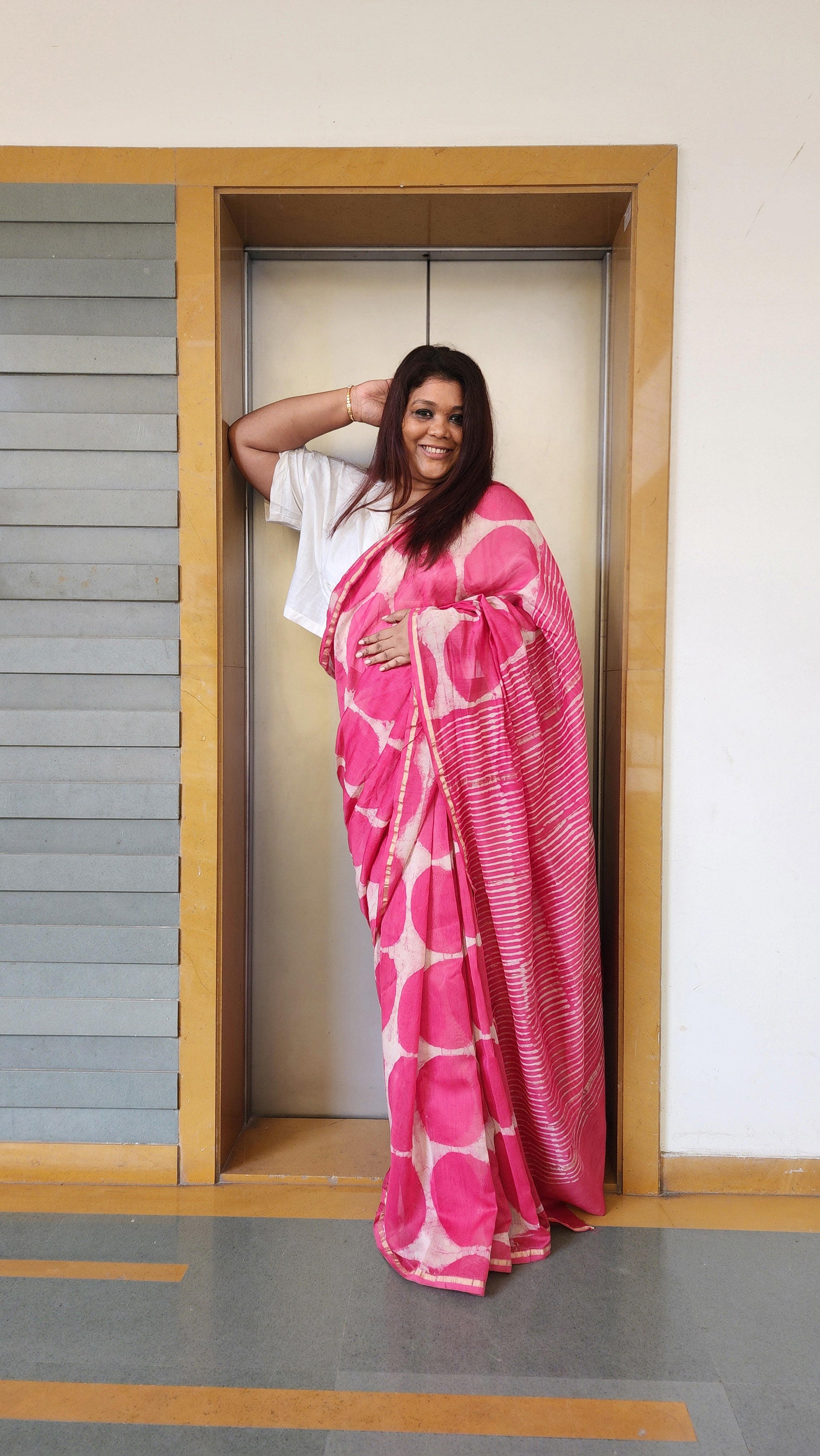 Pink chanderi cotton silk saree with white Bagru handblock motifs and zari border, light and festive handcrafted drape