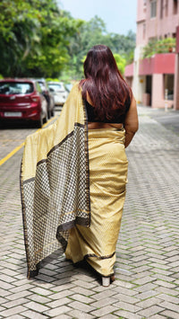 Yellow silk–cotton saree with black Bagru handblock stripes, handcrafted and bold, perfect for everyday elegance.