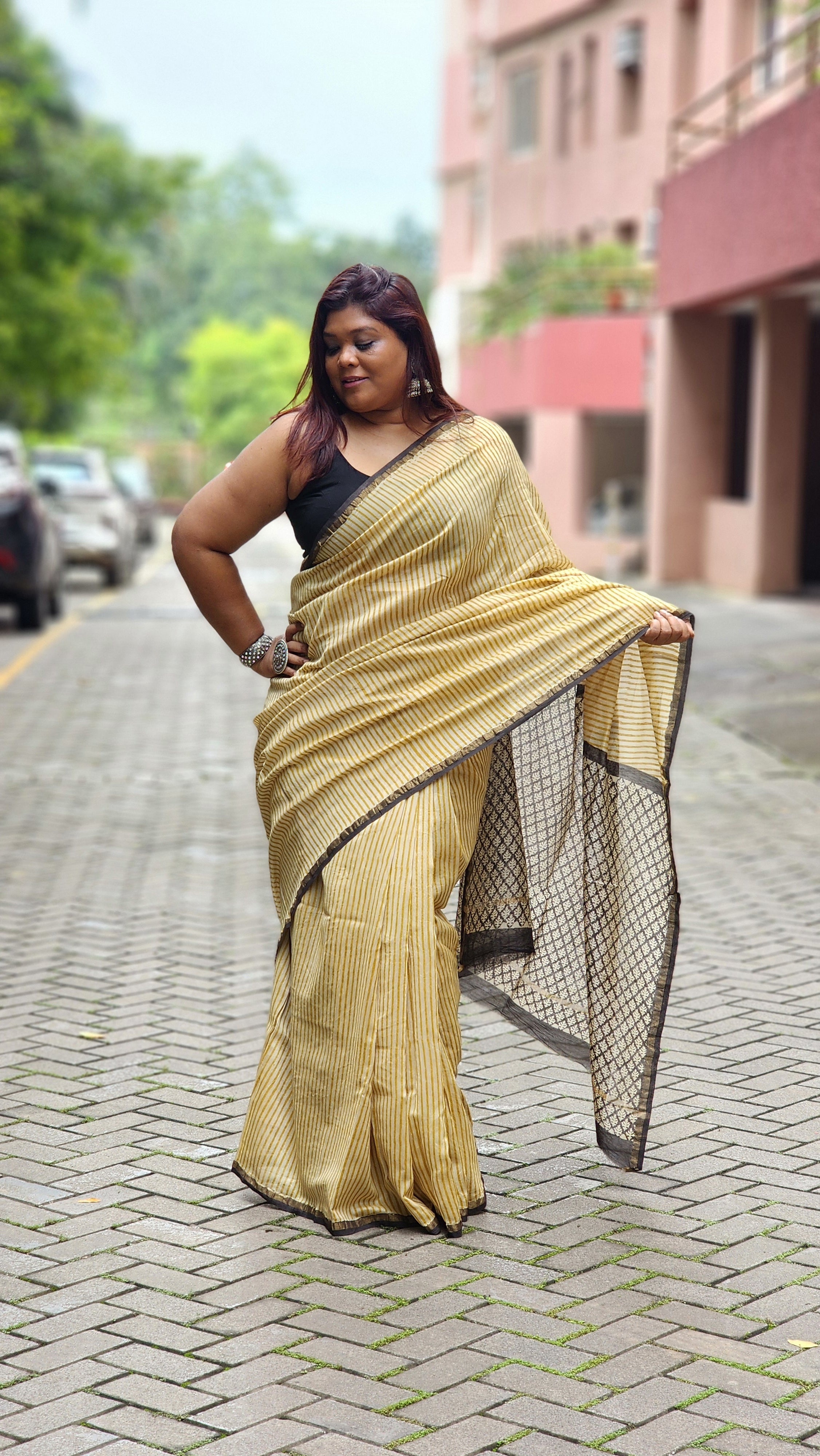 Yellow silk–cotton saree with black Bagru handblock stripes, handcrafted and bold, perfect for everyday elegance.