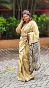 Yellow silk–cotton saree with black Bagru handblock stripes, handcrafted and bold, perfect for everyday elegance.