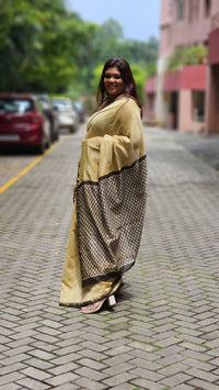 Yellow silk–cotton saree with black Bagru handblock stripes, handcrafted and bold, perfect for everyday elegance.