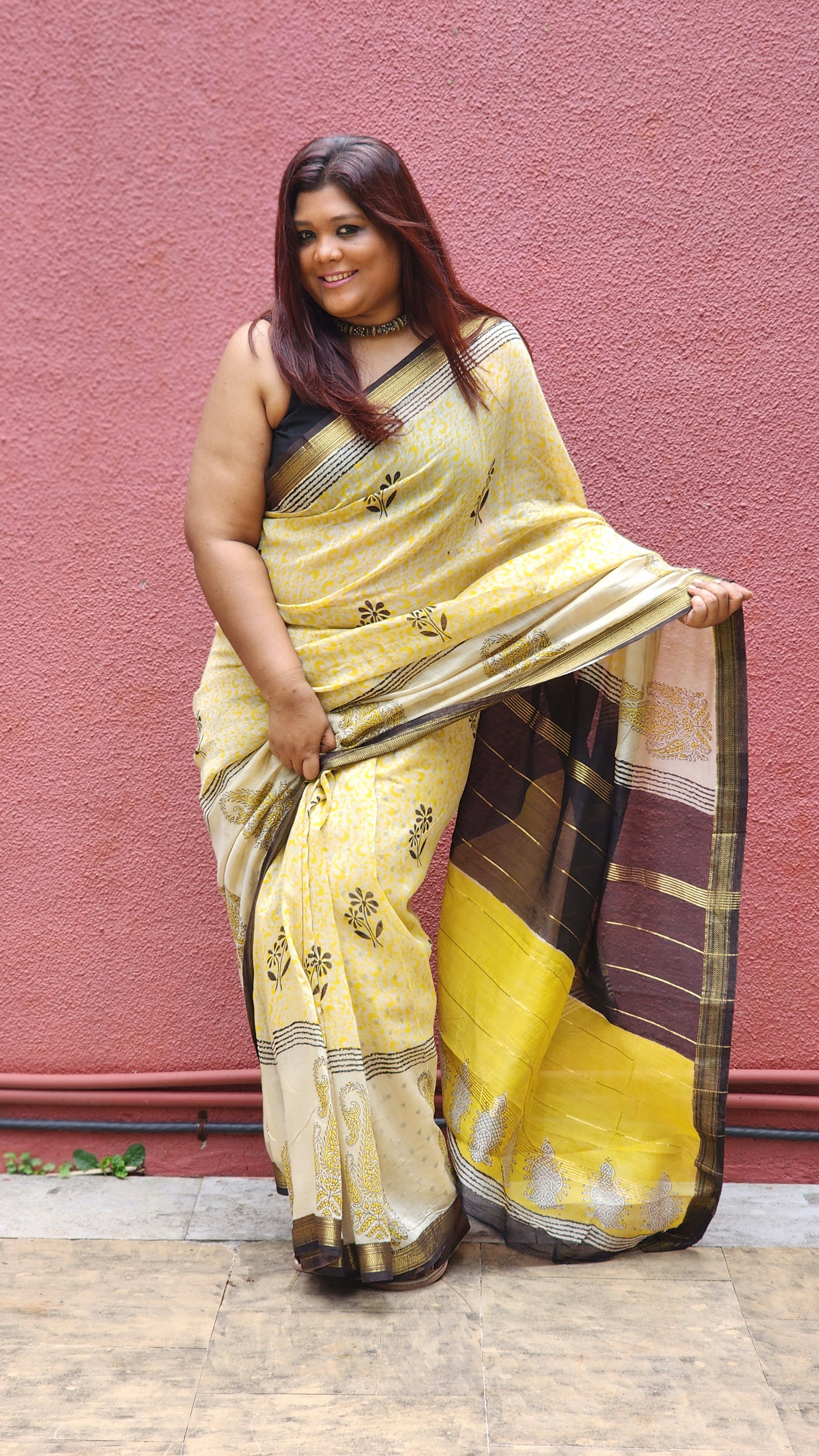 Yellow silk cotton saree with black Bagru handblock stripes, handcrafted and bold, perfect for everyday elegance.