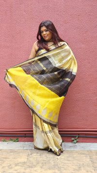 Yellow silk cotton saree with black Bagru handblock stripes, handcrafted and bold, perfect for everyday elegance.