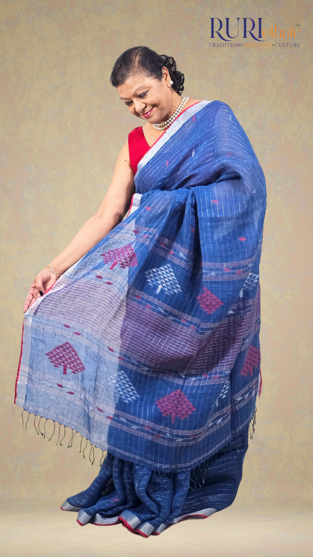 Iris motif detail on navy blue linen saree