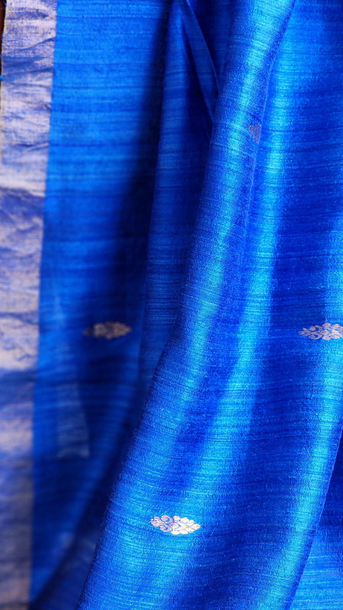 Royal blue matka silk saree with silver zari border.