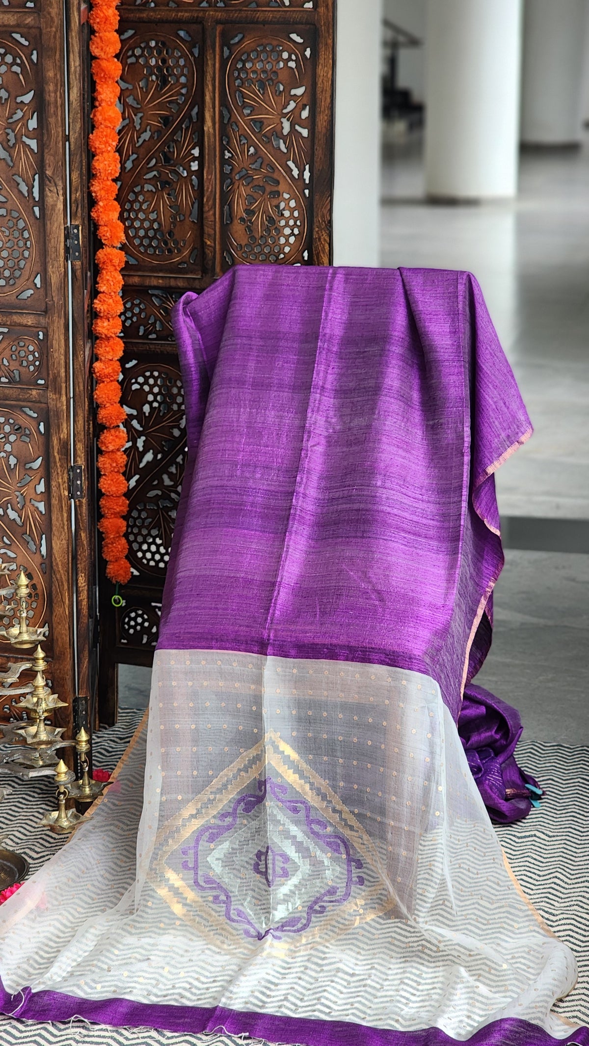 Violet matka silk saree with organza pallu.