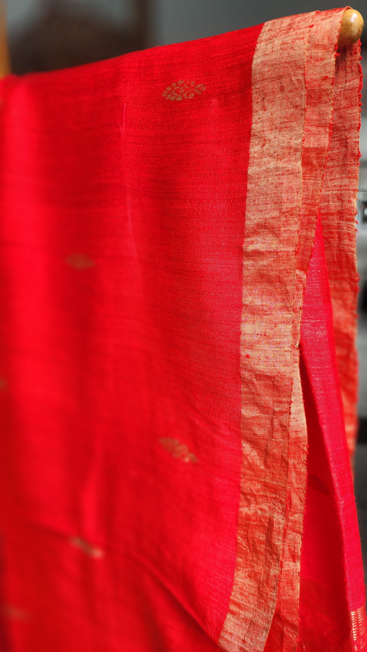 Fiery red matka silk saree with gold zari border from RURIethnic’s Mohana collection.