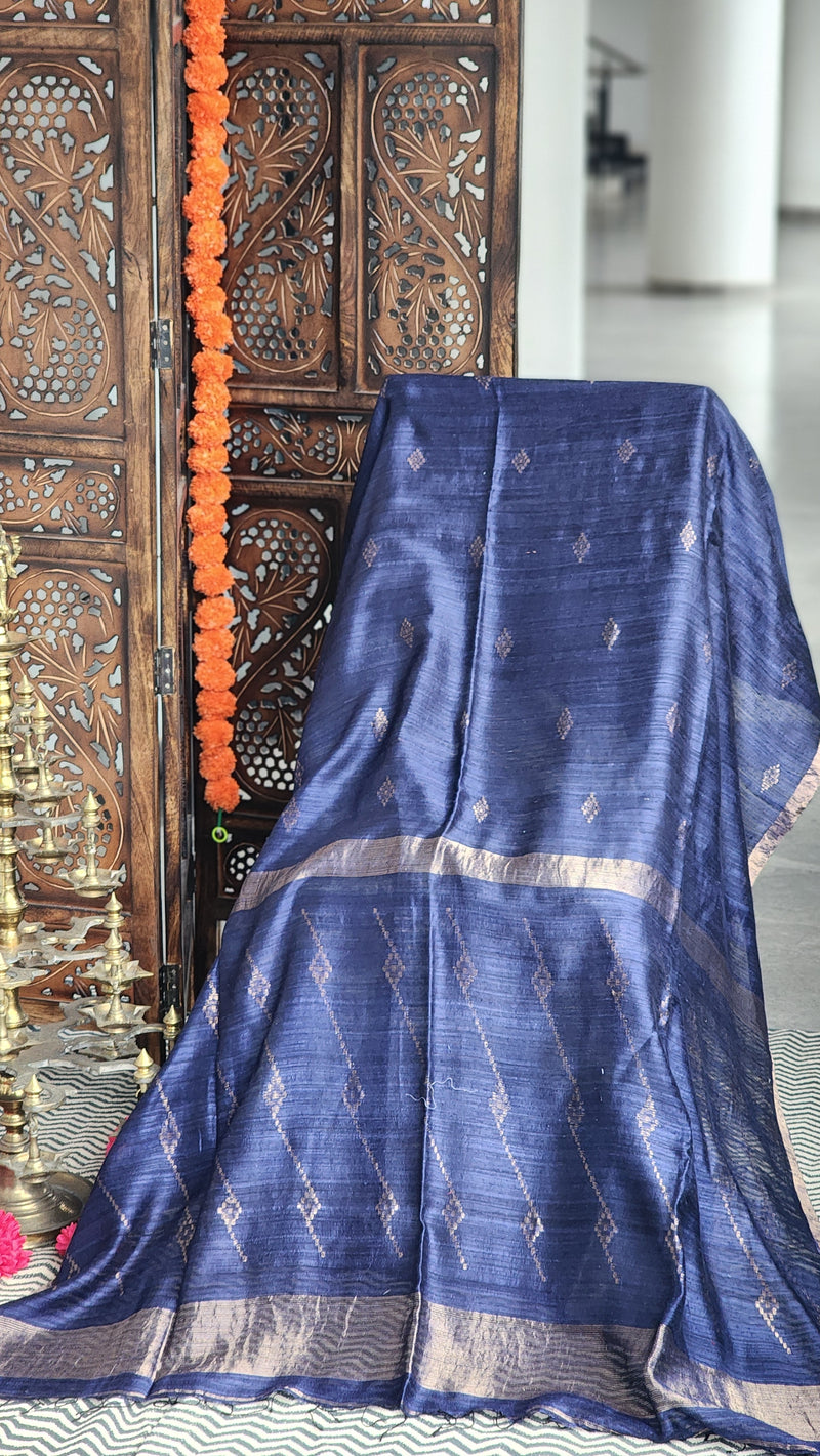 Deep blue matka silk saree with silver zari border.