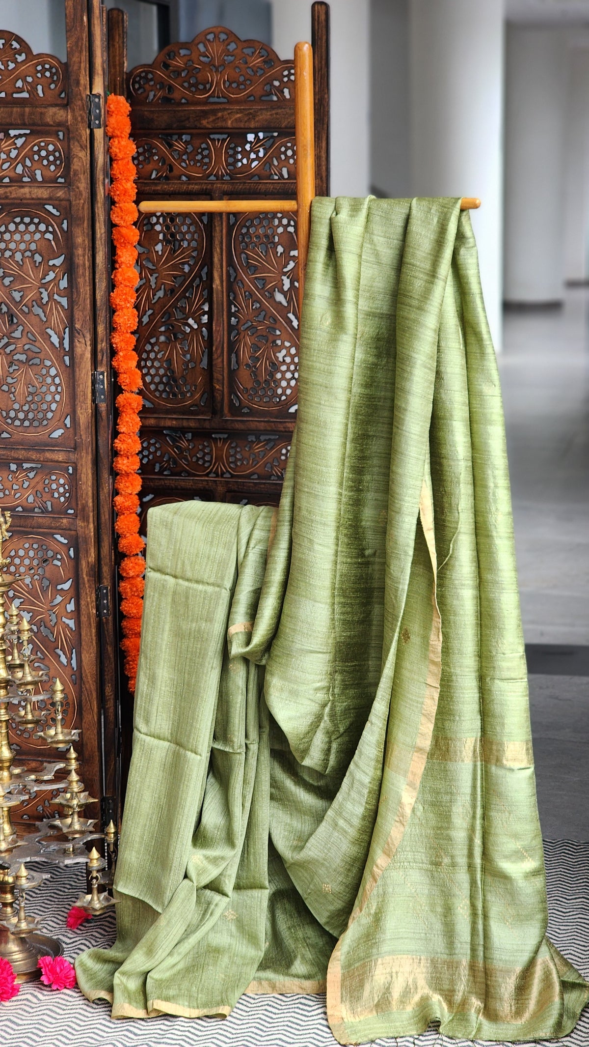 Light sage green matka silk saree with gold border