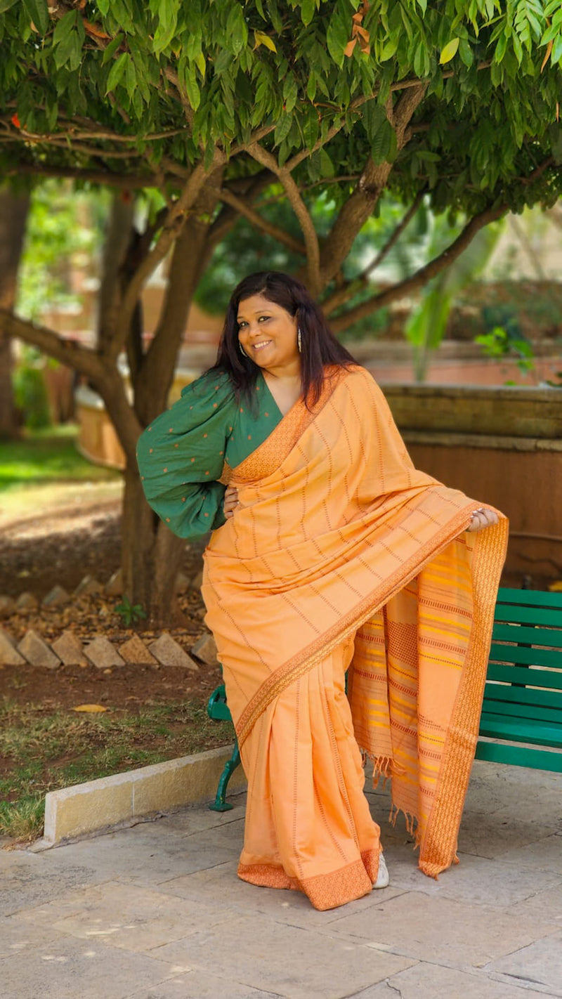 Peach handloom cotton saree with yellow woven lines – cheerful everyday drape from RURIethnic.