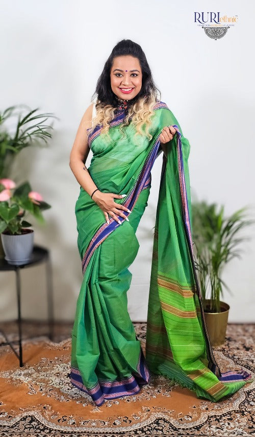 Green cotton handloom workwear saree with blue and red woven border