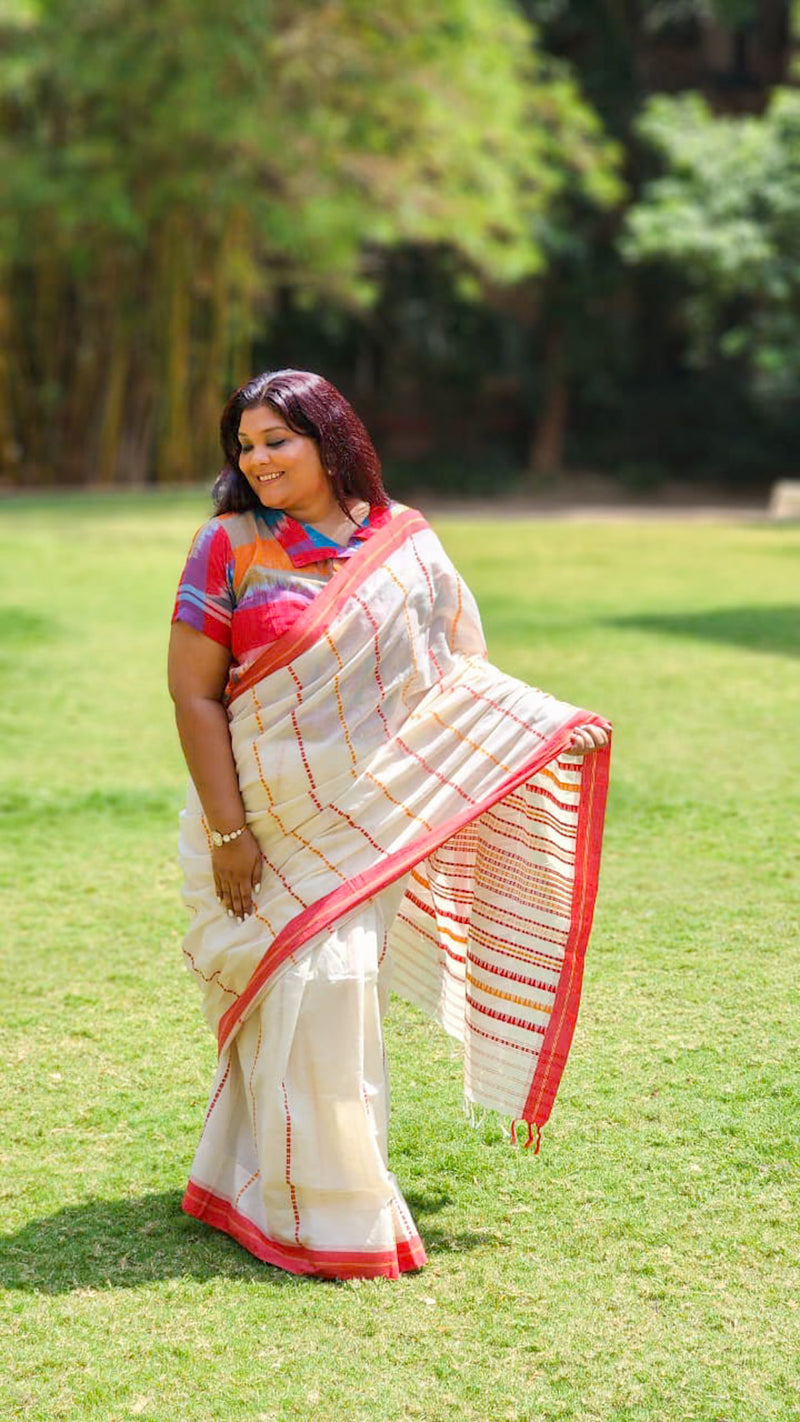 White cotton saree with colourful handwoven stripes playful summer drape from RURIethnic.